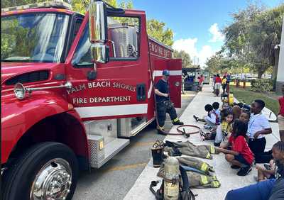 The Palm Beach Shores Fire Department gives a demonstrative presentation to students.